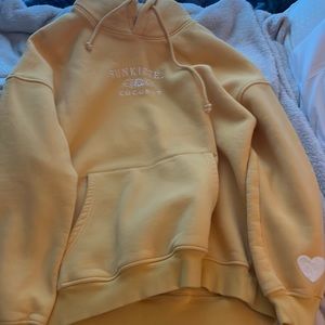 Yellow sunkissed coconut hoodie, size Large, never worn.